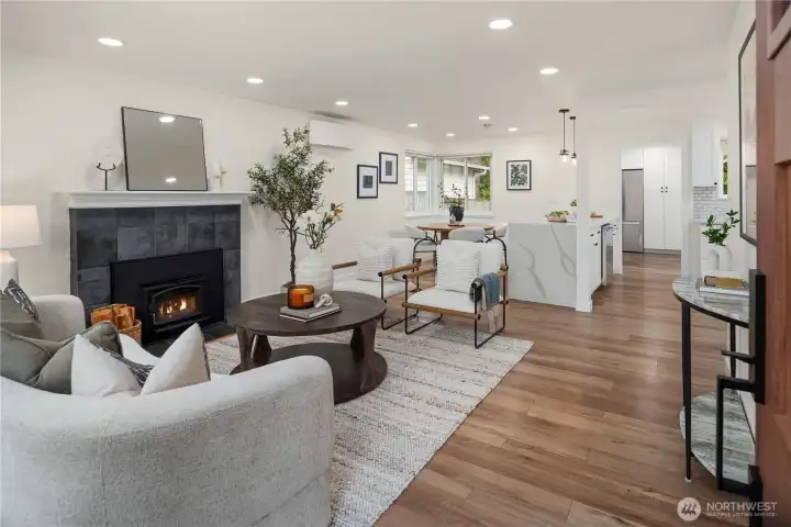 The entry opens up to a stunning interior that is open, bright and immaculate.