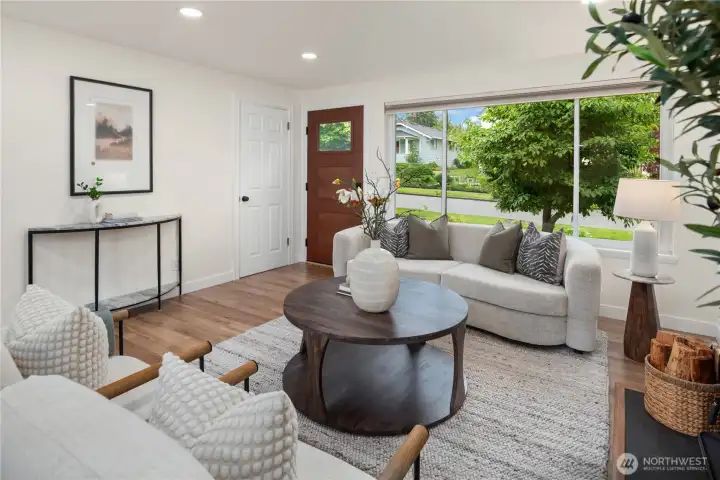 Fantastic recessed lighting and an abundance of windows bring in the light. A huge picture window looks out over the pride-of-ownership street.