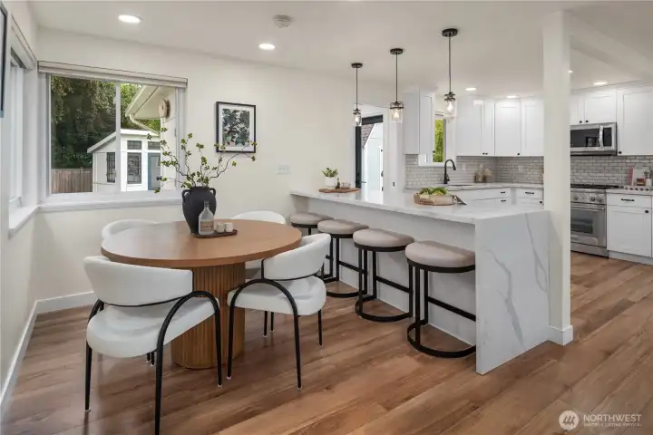 A formal dining room is just off the kitchen with corner windows.
