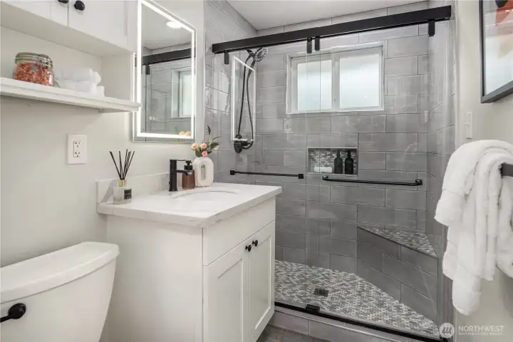 The bathroom is simply luxurious with abundant tile work and designer features.
