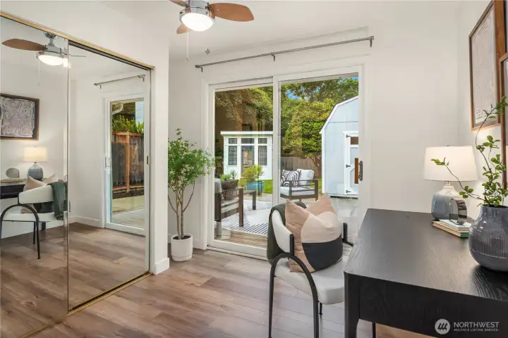 The adjacent room off the primary has 2 closets and access to the back deck.