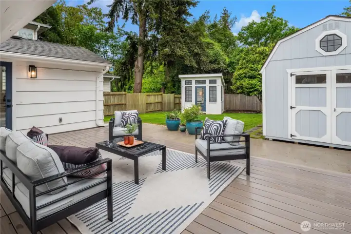 Multiple doors lead out to the newer composite deck that looks out over the fenced backyard.