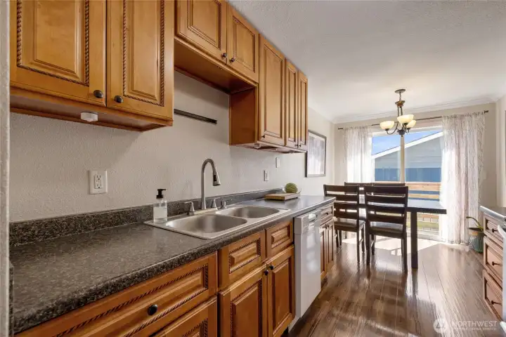 Plenty of cabinet storage in this manageable kitchen.