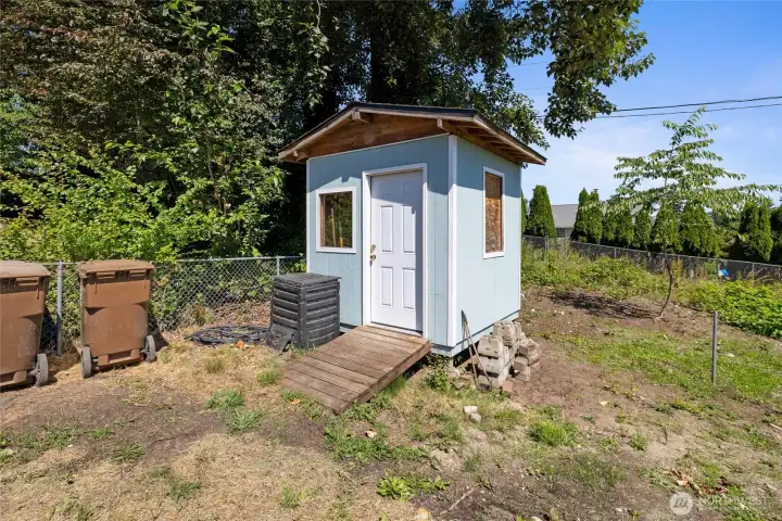 This outbuilding is a great place to store gardening tools or turn it into a playhouse!