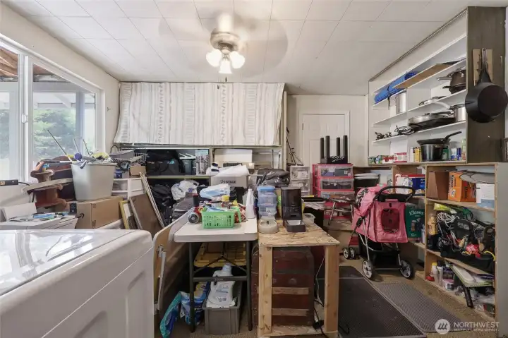 I know this photo shows a lot- but they are in process of moving and I just had to show what  HUGE laundry room/pantry/storage space this home has!! An incredible bonas just off the garage and dinning area. Could easily be converted into a different use as well.