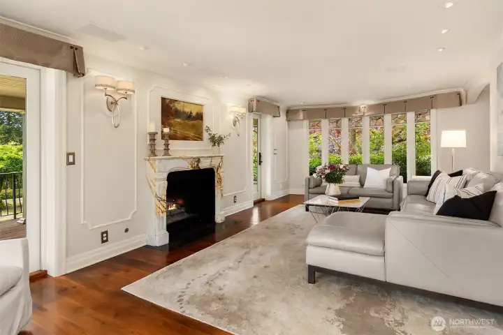 View of the north living room wall, highlighting the custom curved windows and natural light.