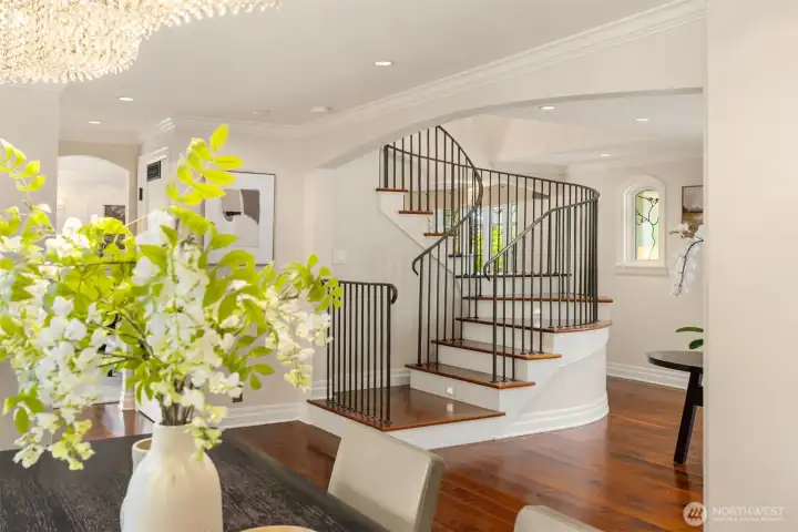 Stunning view of the architectural staircase as seen from the dining area.