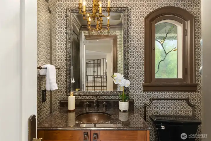 This powder room on the main floor features exquisite craftsmanship and rich, thoughtful details throughout.