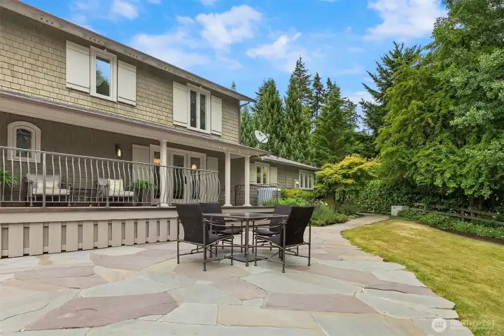 This beautifully landscaped south-facing patio features a professionally installed drip irrigation system, perfect for effortless container gardening.