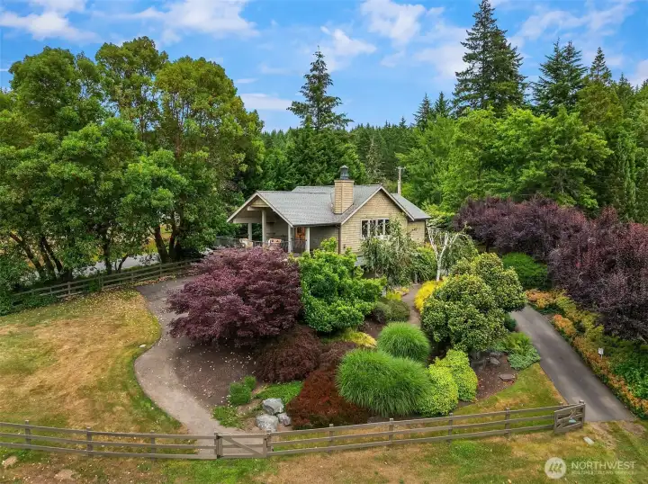 This charming detached accessory dwelling unit, affectionately known as the "Tree House," offers complete independence with its own private well and dedicated drainfield.