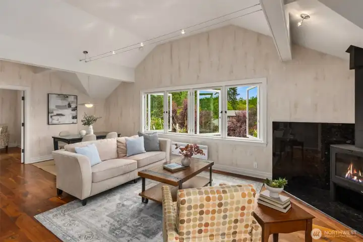 The interior walls feature a unique finish designed to replicate the texture and appearance of the birch tree bark visible just outside the windows.