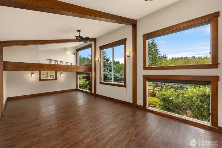 The studio features expansive south-facing windows that showcase breathtaking views of the lower acreage.