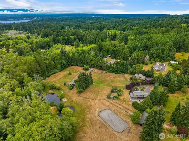 This aerial view showcases the full property layout, spanning 9.36 acres across three tax parcels.