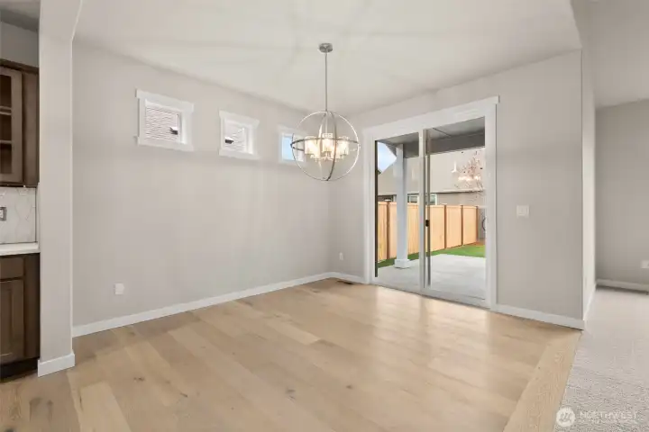 Great dining area with slider to backyard. Great dining area with slider to backyard.