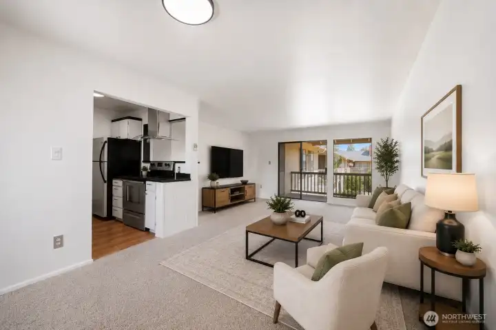 Dining area looking into living room - Virtually staged
