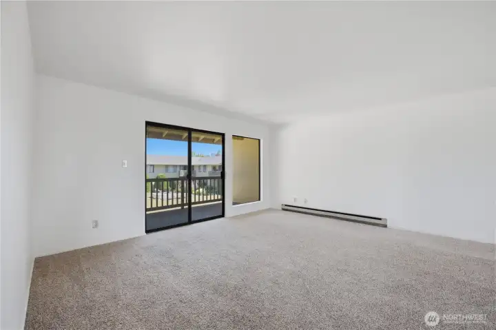 Living room with balcony over looking the courtyard