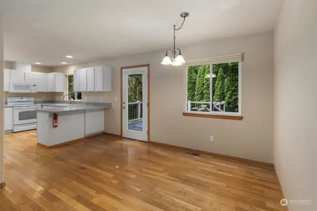 Kitchen sits adjacent to living room.