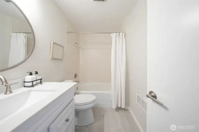 Remodeled full bath.