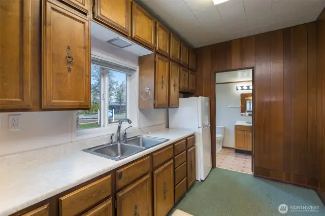 Kitchen looking into Bathroom.