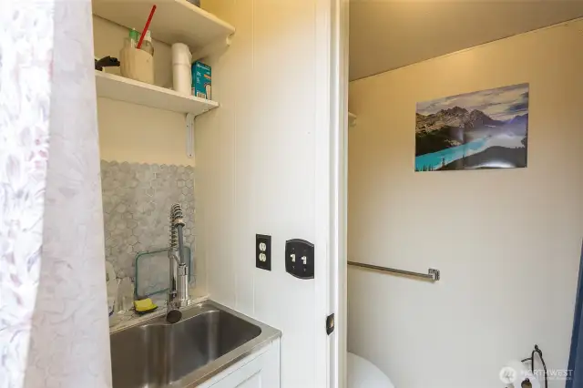 Half Bath in Log Outbuilding.