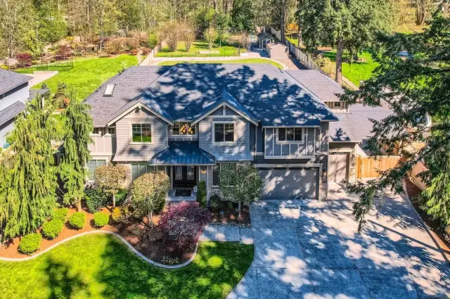 Estate home featuring covered RV parking, an oversized 3-car garage, and a wired backup generator.