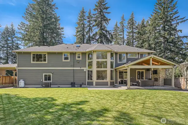 Spacious backyard with flat, fully fenced lawn—perfect for playsets, a playhouse, or even a small soccer pitch. Ideal for outdoor fun, entertaining, and flexible family living in a secure and private setting.
