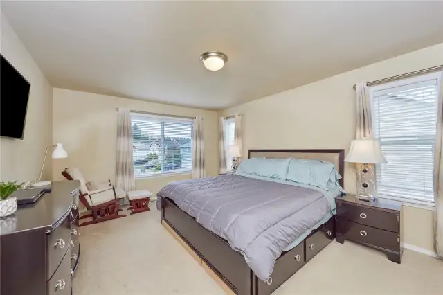 Enter into the Primary room with a lot of space and large windows to let in natural light