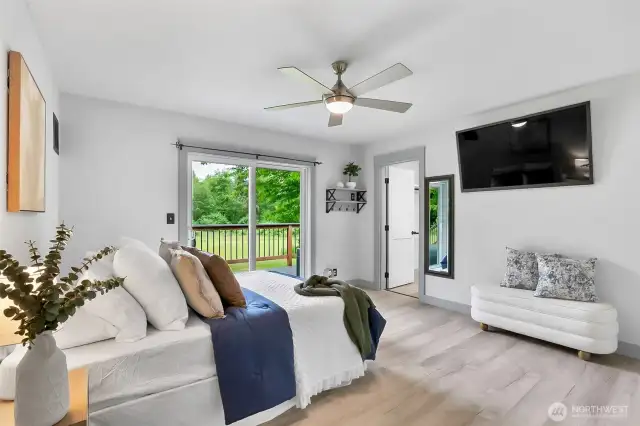 Primary bedroom with slider out to the deck.