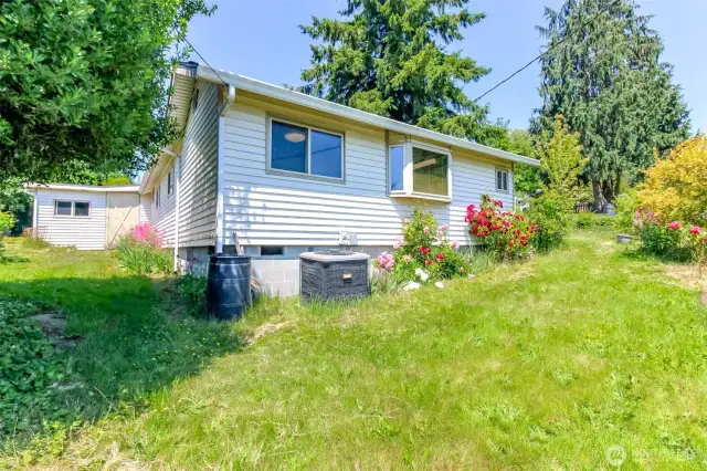 Side of the house visible from the road
