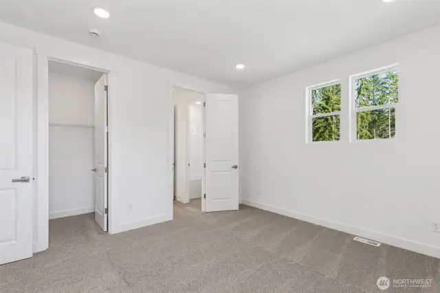 Bedroom with walk-in closet