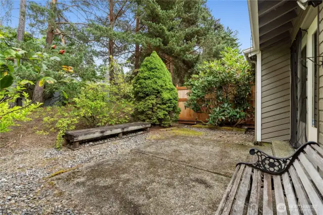 Private backyard patio off french doors in living room & garden area