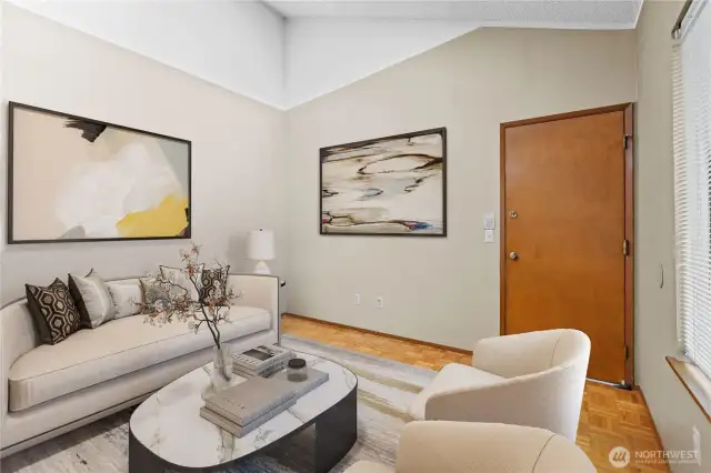 Extra family room off of kitchen island side & entrance to garage- virtually staged