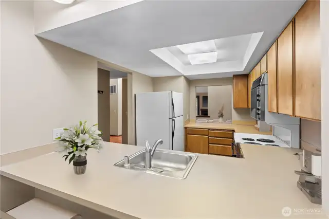 Kitchen with countertop eating space & fully functional retro appliances -virtual staging