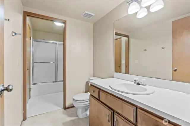 En Suite primary bathroom opens up to another door that connects to hall bathroom for easy access to full shower & tub