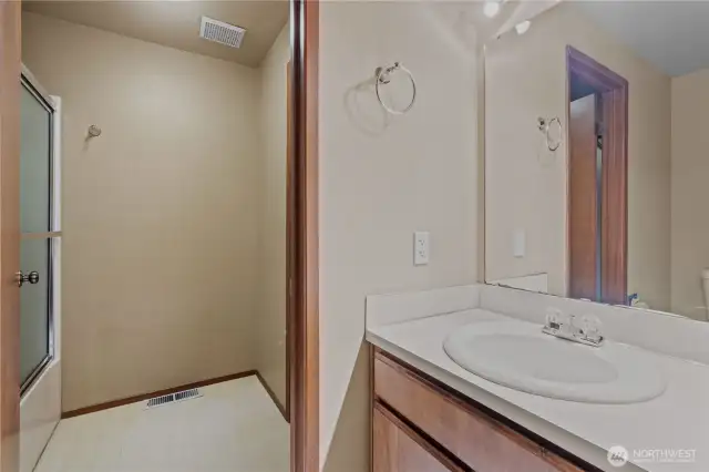 Hall bath has full shower & tub accessible to both en suite bathroom & hallway bathroom