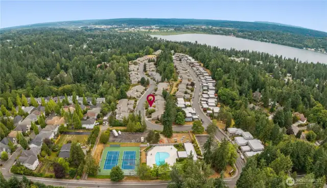 Community with amenities - Pool, tennis courts, clubhouse, play area, fitness, RV & boat parking options.
