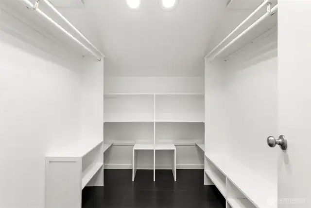 Primary bedroom walk in closet