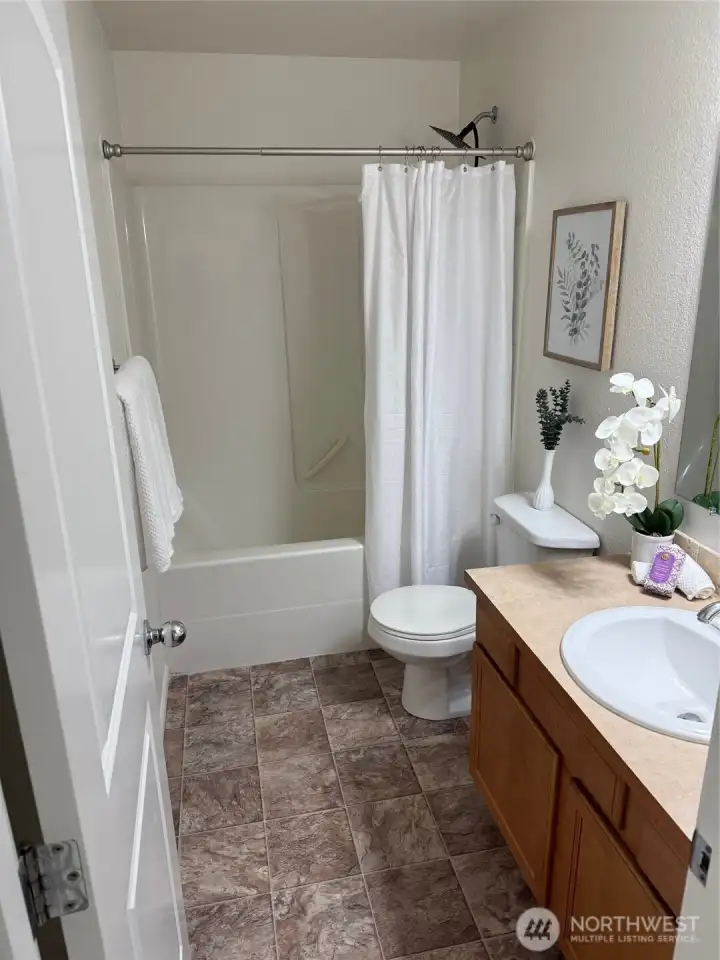 Full bath across from laundry room