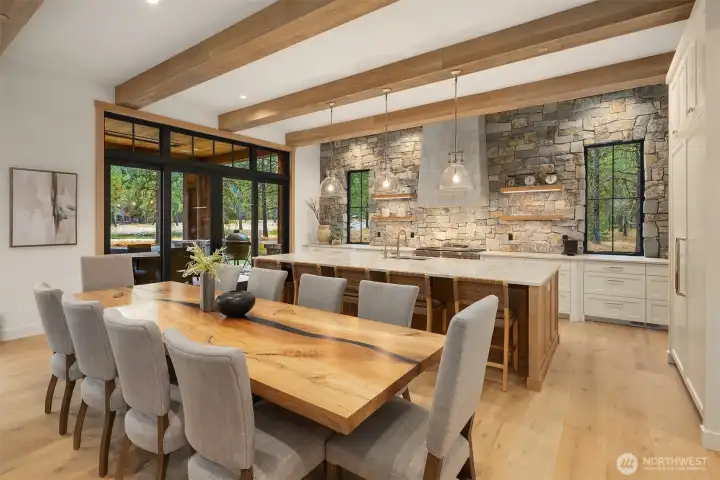2.5” thick floating white oak shelves set into  heavy dimensional stone wall with windows.