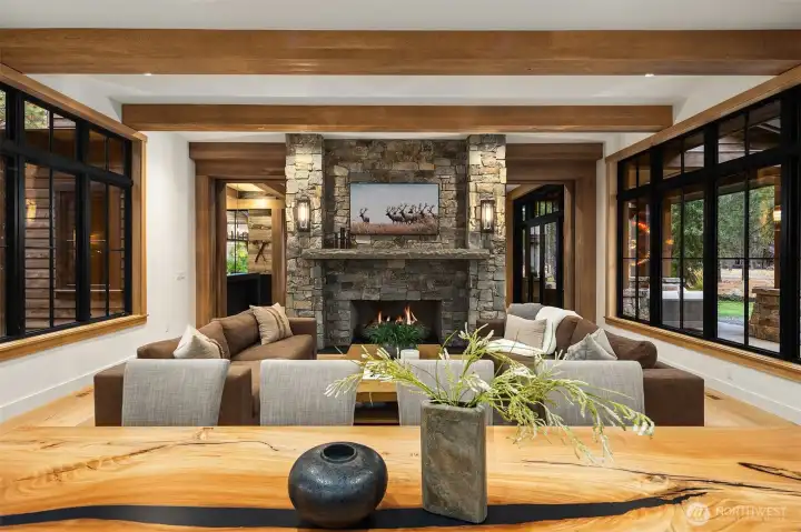 6” thick solid bluestone mantle weighs over 2000 lbs. The fireplace goes through the  floor and sits on a concrete footing so that the over 18,000lbs total weight is not sitting  on the floor system.