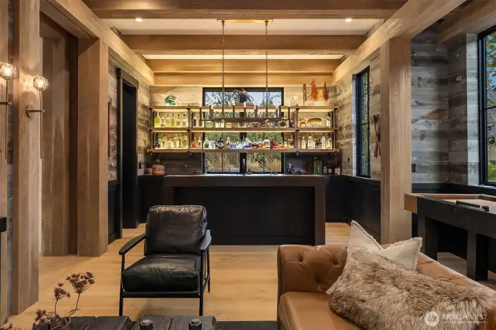 Built in Dishwasher, pellet ice maker, 2 undercounter refrigerators, make for a high  performance and high output functioning bar. 16’ custom made shuffleboard table can  stay with house.