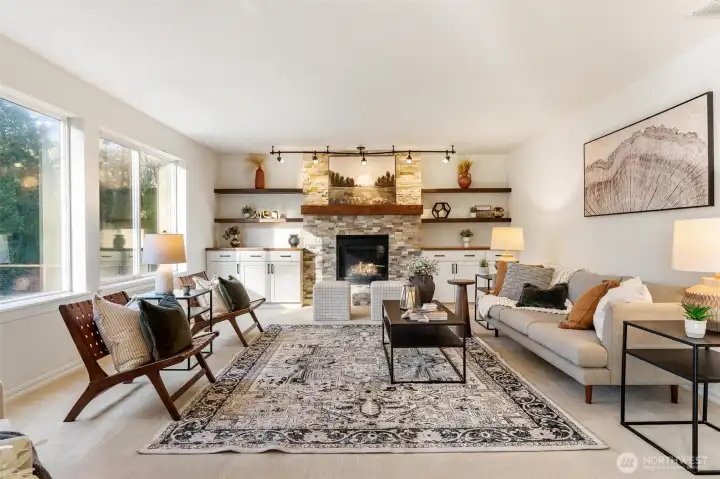 Bright living room with large windows, natural light, and open layout—perfect for everyday living and entertaining.