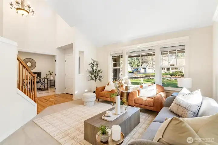 Bright living room with large windows, natural light, and open layout—perfect for everyday living and entertaining.