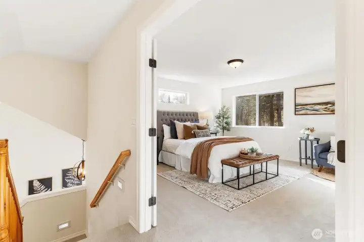 Open upper landing overlooking the main level, adding architectural interest and natural light.