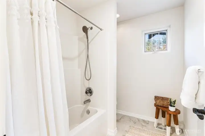 Clean, well-appointed ¾ bathroom provides convenient access for the additional rooms.