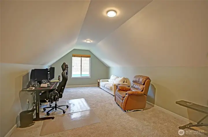 Located upstairs, this generous bonus room provides a versatile space for a home office, playroom, or additional living area. Tucked away from the main living spaces, it’s perfect for both productivity and relaxation.