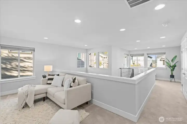 The loft area is a perfect spot for a playroom, media room or office.