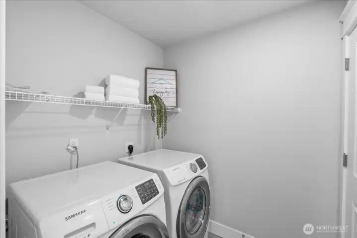 The upstairs laundry room makes staying organized on laundry day a cinche.