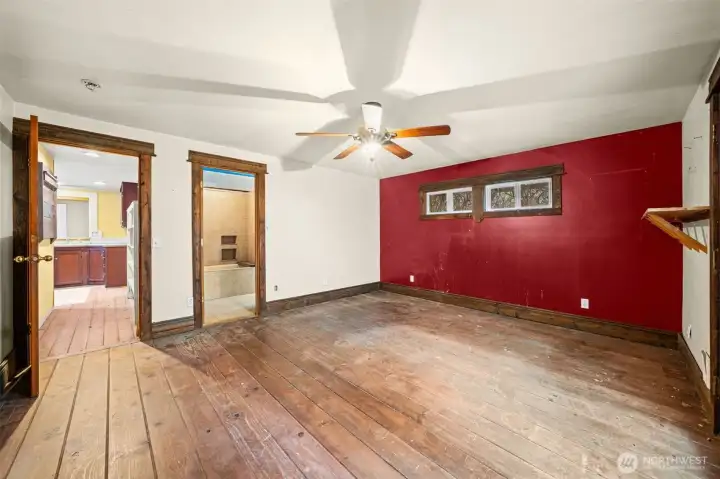 The Primary Suite features wood floors, ceiling fan, and direct access to en suite bath. Great bones ready for cosmetic updates and personalization.