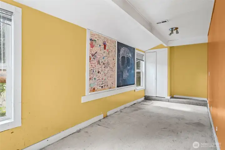 Flexible bonus room with natural light, ideal for office, studio, or additional living space. Ready for updates to suit a variety of needs.